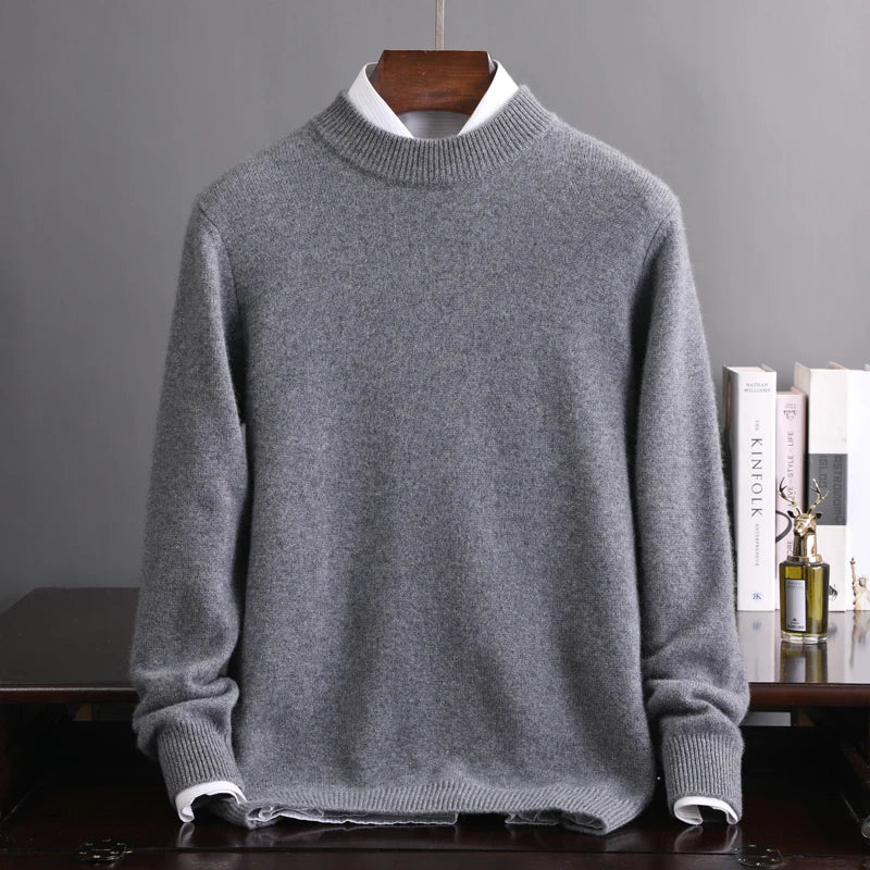 Gray sweater on a hanger against a gray background