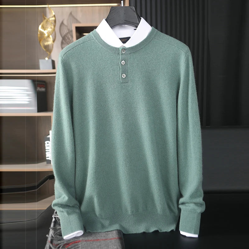 Green sweater with white collar on a hanger against a dark background