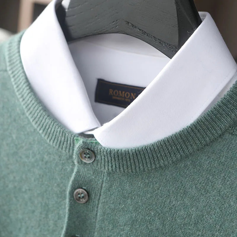 Green sweater with white collar and visible brand label on a blurred background