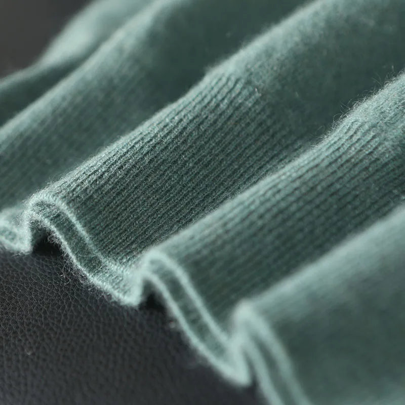 Close-up of green fabric with a textured pattern