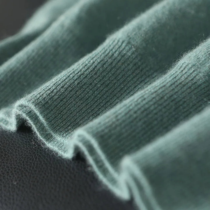 Close-up of green fabric with a textured pattern