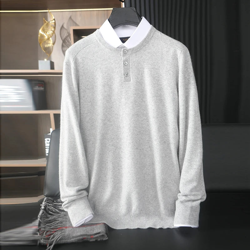 Gray sweater with white collar on a hanger against a blurred indoor background