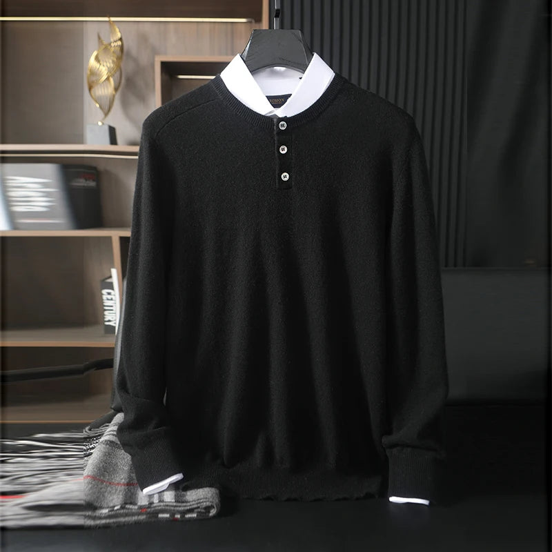 Black sweater with white collar on a hanger against a dark background