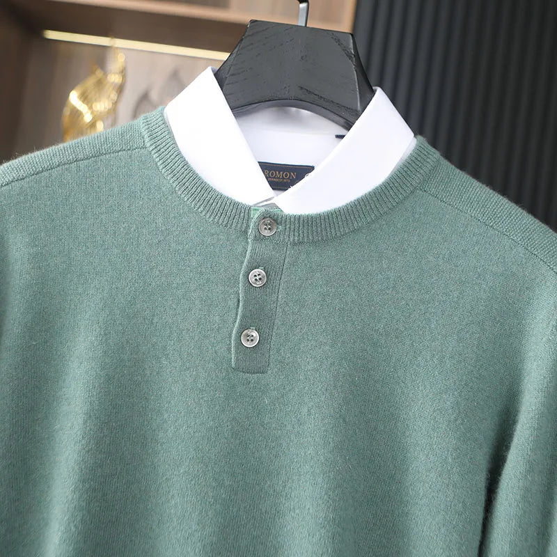 Green sweater with white collar on a hanger