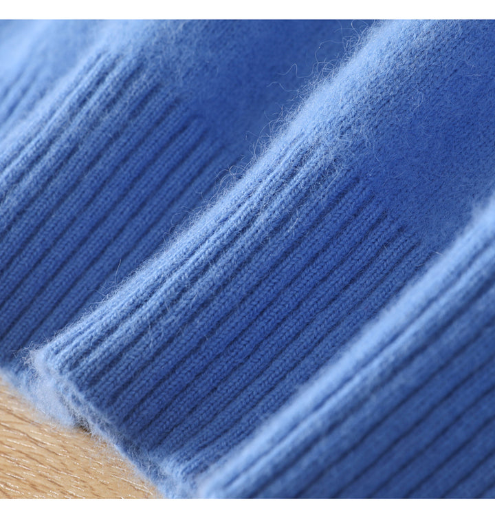 Close-up of blue yarn with a wooden surface underneath