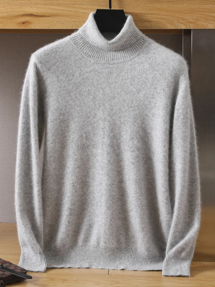 Gray turtleneck sweater on a hanger against a wooden background