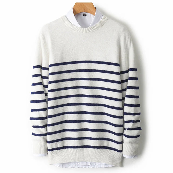 White sweater with blue stripes on a wooden hanger against a white background