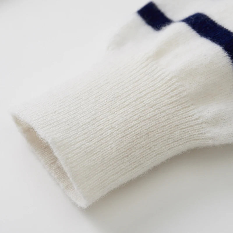 White sock with a blue stripe on a light gray background