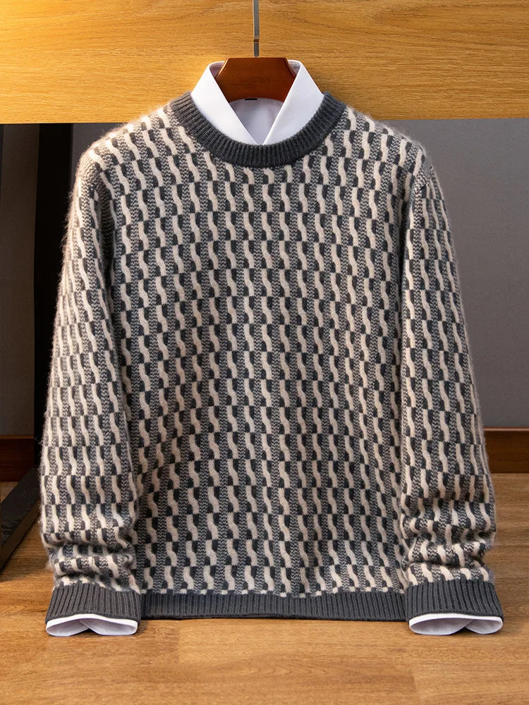 Patterned sweater on a hanger against a wooden background