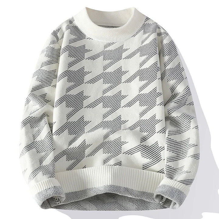 White sweater with black geometric pattern on a white background