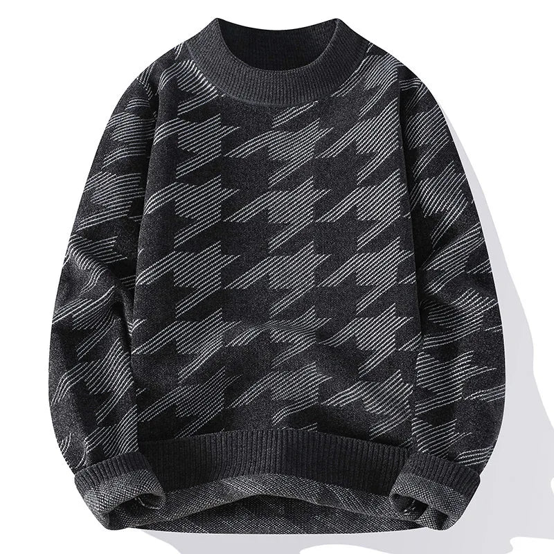 Black and gray patterned sweater on a white background