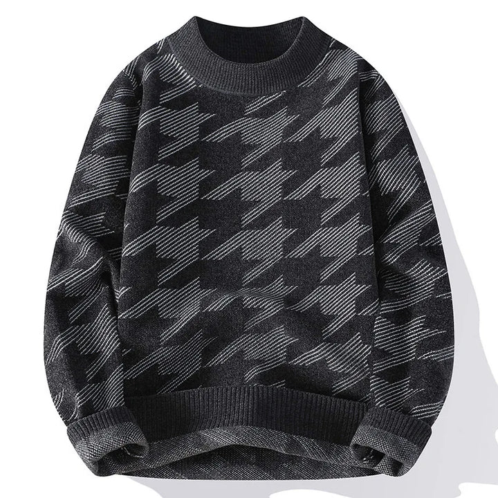 Black and gray patterned sweater on a white background