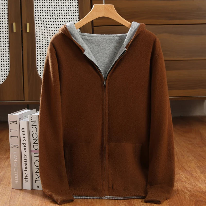 Brown hoodie with gray lining on a wooden hanger against a wooden background