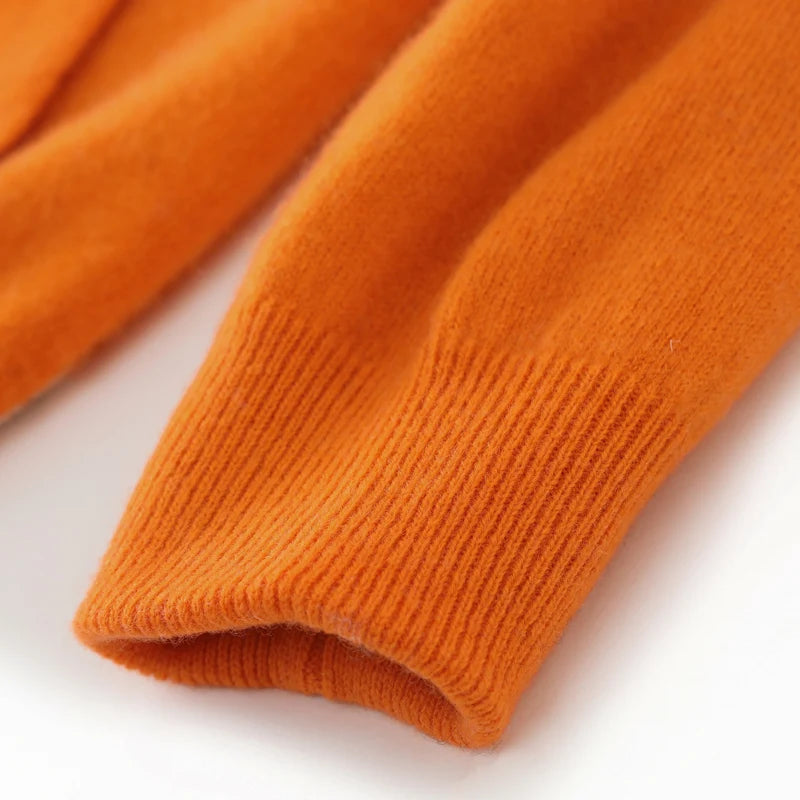 Close-up of orange knitted fabric on a white background