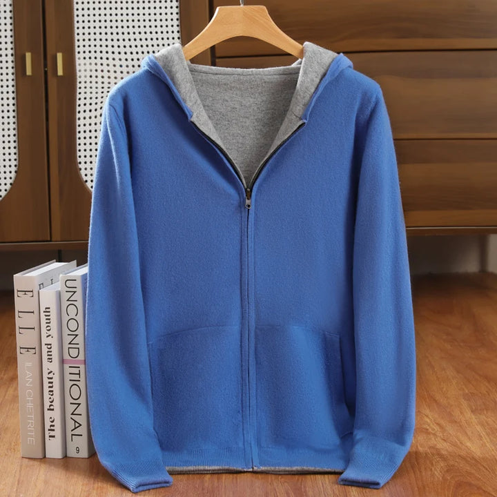 Blue hoodie with gray lining on a wooden hanger against a wooden background