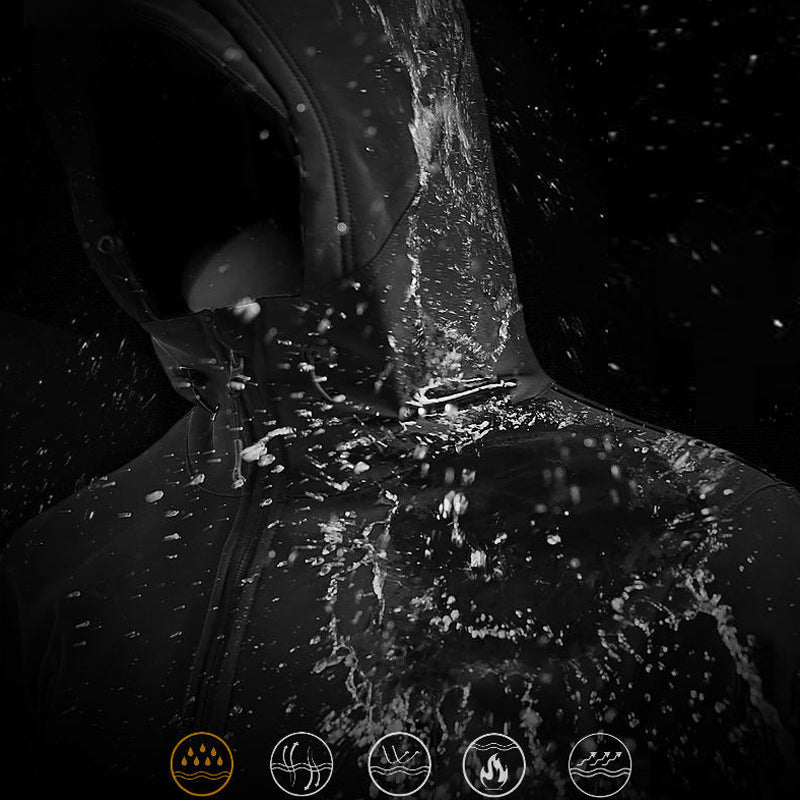 Close-up of a person wearing a black jacket with water splashing on it, against a dark background.