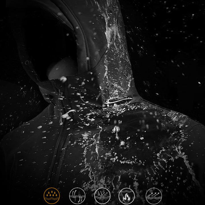 Close-up of a person wearing a black jacket with water splashing on it, against a dark background.