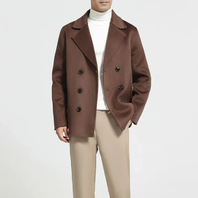 Brown coat worn by a person on a white background