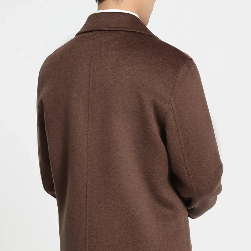 Brown coat worn by a person on a white background