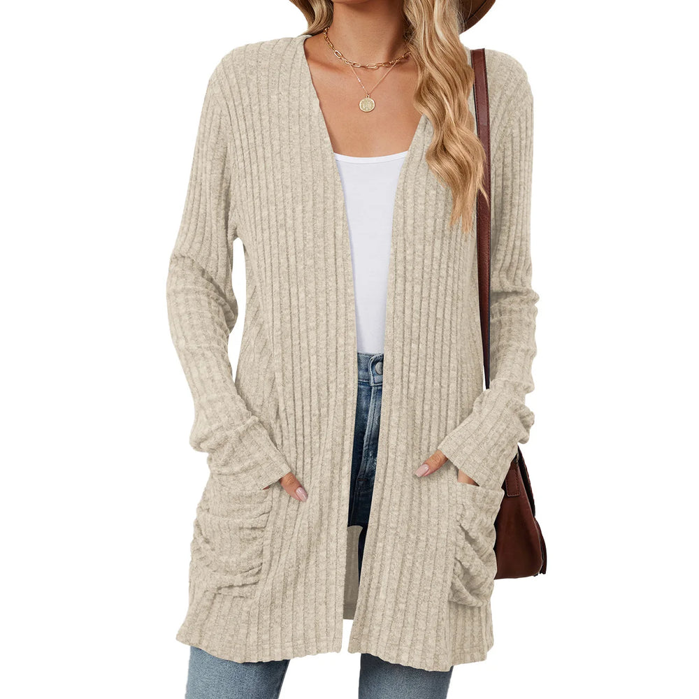 Beige cardigan worn by a person on a white background