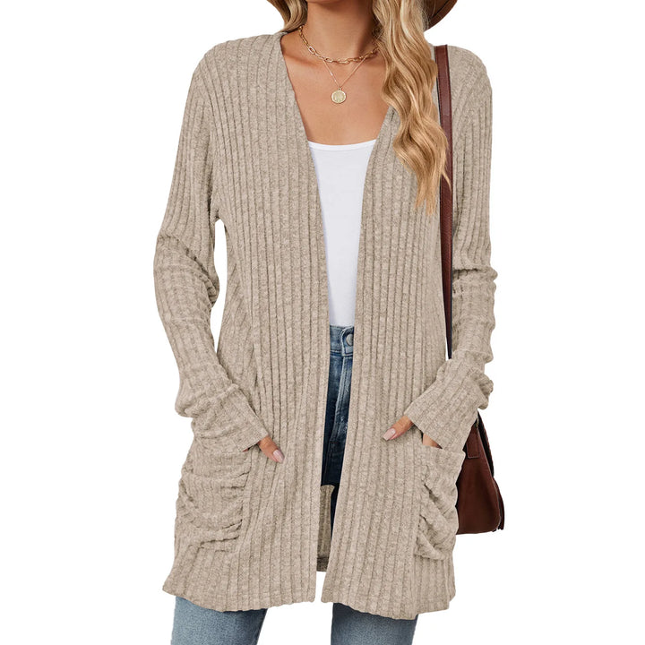Beige cardigan worn by a person on a white background