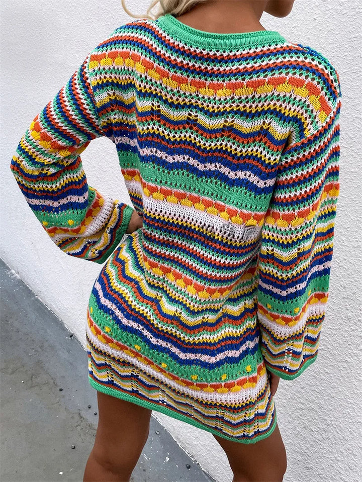 Colorful striped sweater worn by a person against a white background