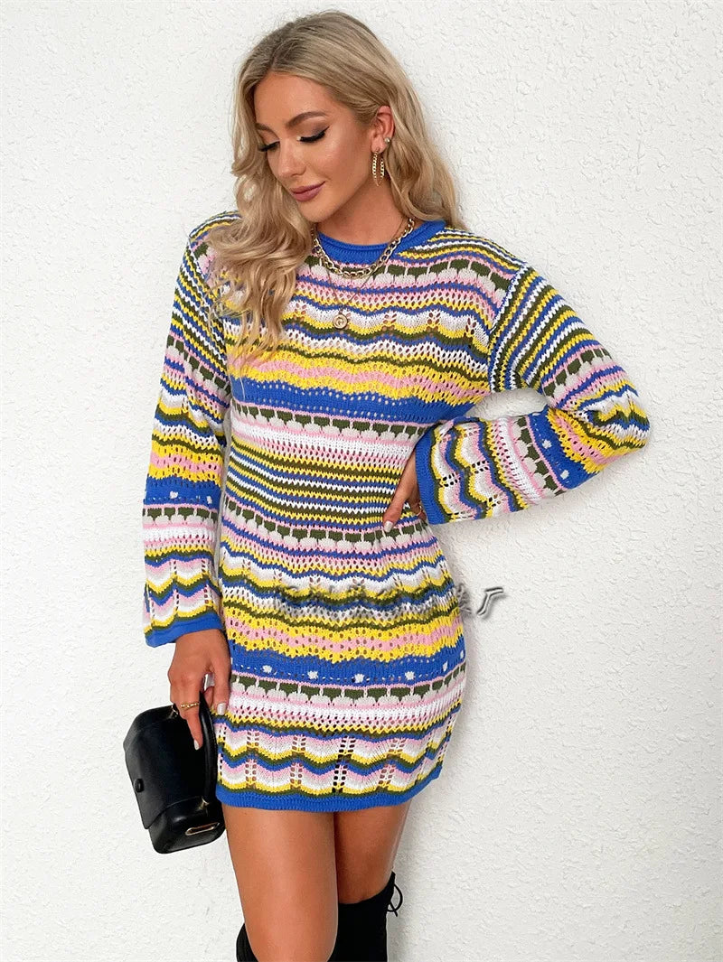 Woman wearing a colorful patterned dress against a white background