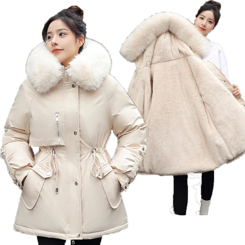 Woman wearing a beige winter coat with a fur-lined hood on a white background