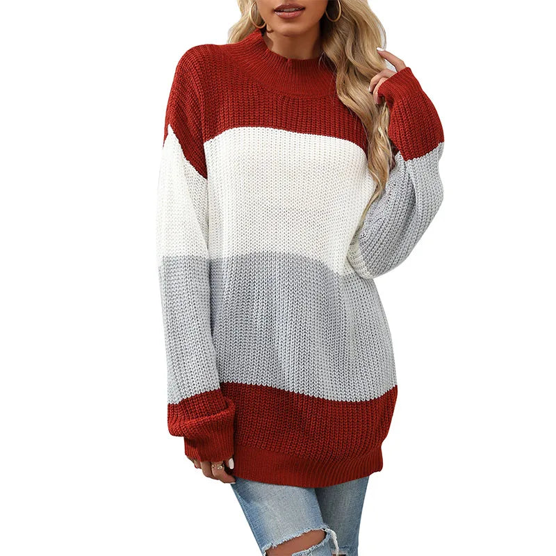 Color-blocked sweater with red, white, and gray sections on a white background
