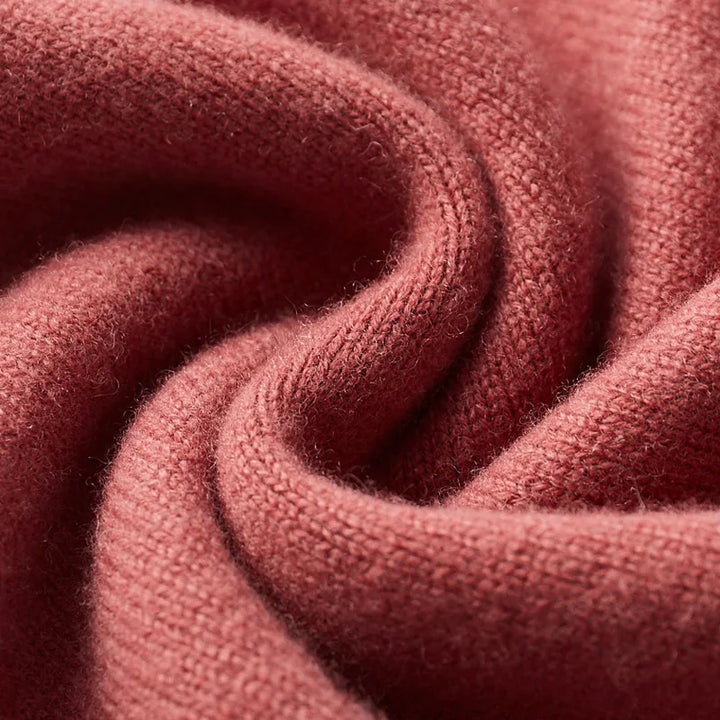 Close-up of a textured red fabric with folds
