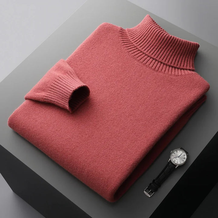 Red sweater and watch on a gray surface