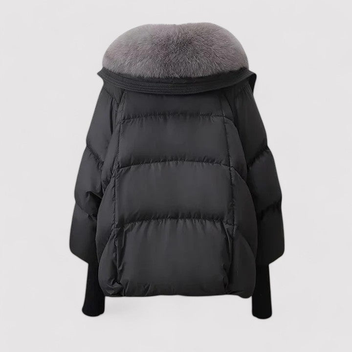 Black puffer jacket with gray fur hood on a light gray background