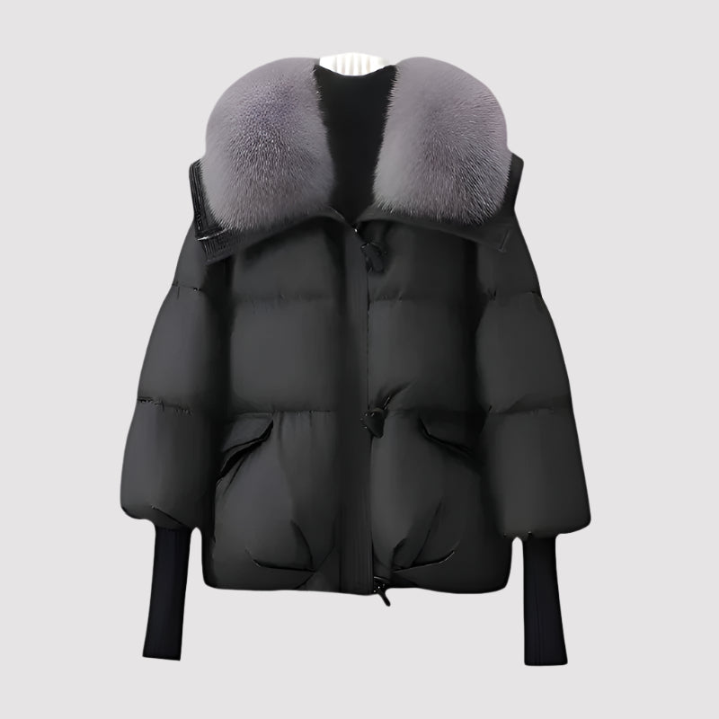 Black puffer jacket with gray fur hood on a light gray background