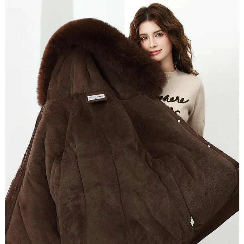Brown fur-lined coat with a woman wearing a beige sweater in the background