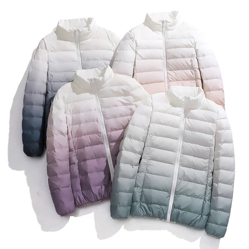 Four gradient-colored puffer jackets on a white background