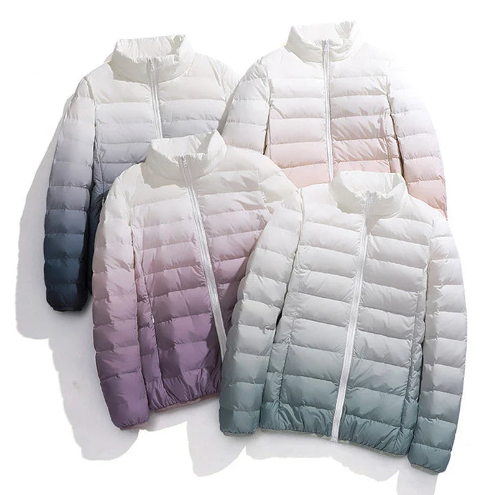 Four gradient-colored puffer jackets on a white background