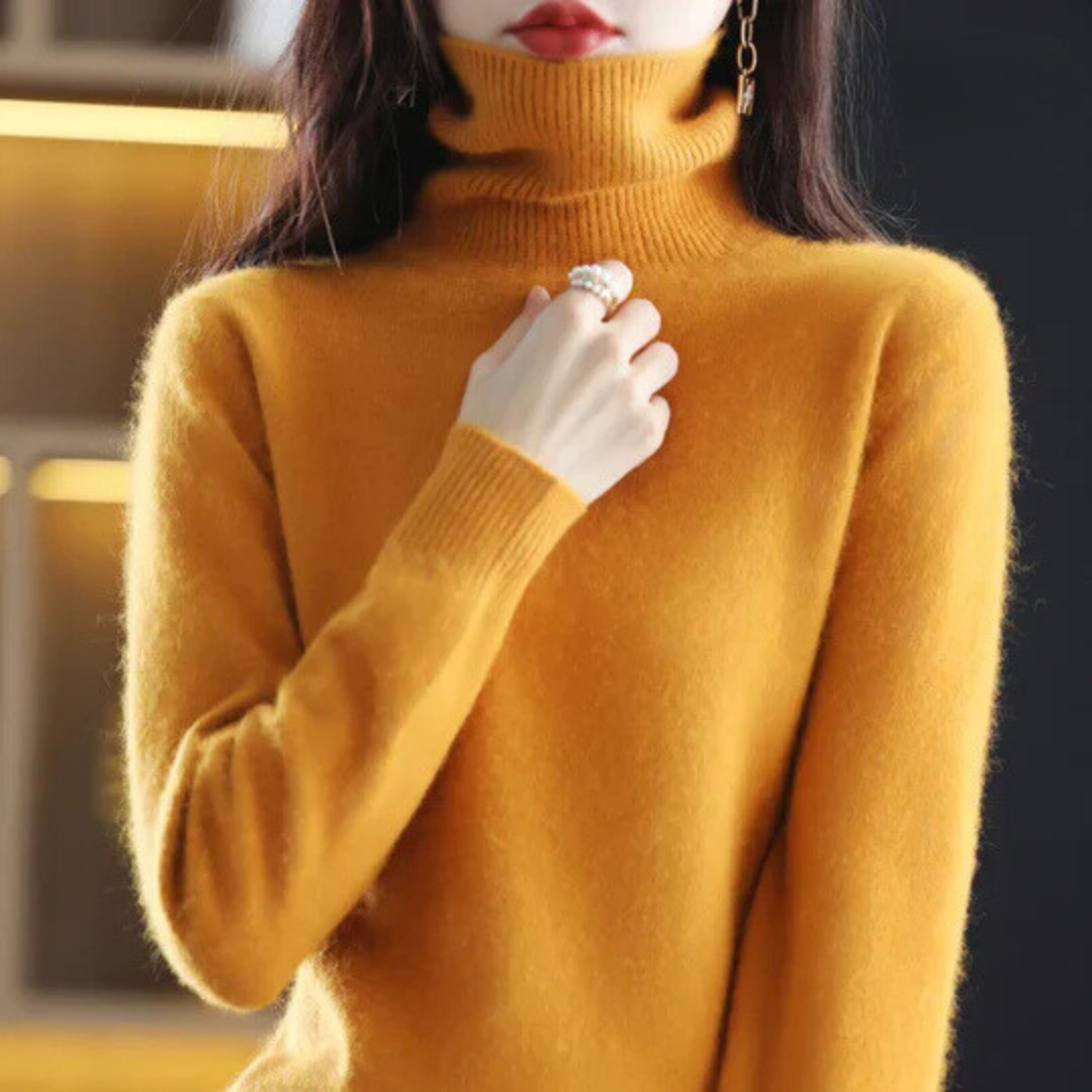 Yellow turtleneck sweater worn by a person with a blurred background