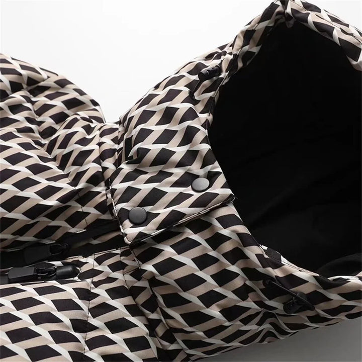 Close-up of a black and white patterned fabric with buttons on a gray background